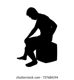 Silhouette of sitting man on white