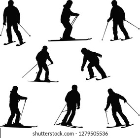 silhouette of skiers
