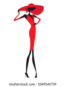  Silhouette of a slender model in a fitting elegant red dress and a wide-brimmed red hat