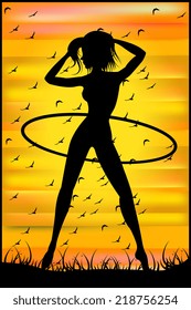 Silhouette of a slender woman doing exercises with hula-hoop on the sunset sky background 