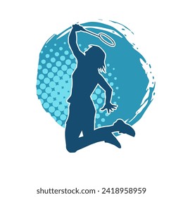 Silhouette of a slim female athlete doing badminton sport. Silhouette of a woman badminton sport player in action pose.