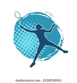 Silhouette of a slim female athlete doing badminton sport. Silhouette of a woman badminton sport player in action pose.