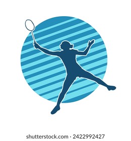 Silhouette of a slim female athlete doing badminton sport. Silhouette of a woman badminton sport player in action pose.