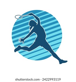 Silhouette of a slim female athlete doing badminton sport. Silhouette of a woman badminton sport player in action pose.