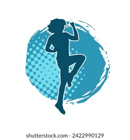 Silhouette of slim female doing exercise. Silhouette of a sporty woman doing gym workout pose. 