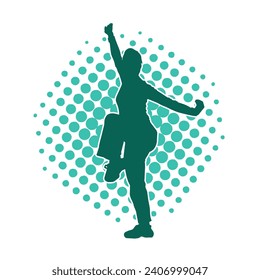 Silhouette of a slim female doing martial art pose. Silhouette of a martial art woman in action pose.