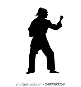 Silhouette of a slim female doing martial art pose. Silhouette of a martial art woman in action pose.