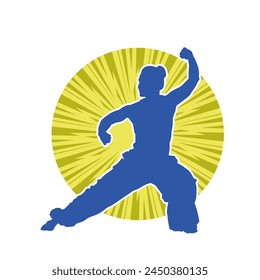 Silhouette of a slim female doing martial art pose. Silhouette of a martial art woman in action pose.