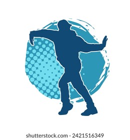 Silhouette of a slim man dancing pose. Silhouette of a male dancer in action pose.