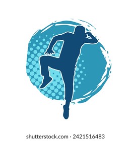 Silhouette of a slim man dancing pose. Silhouette of a male dancer in action pose.