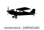 Silhouette of a small propeller airplane in flight