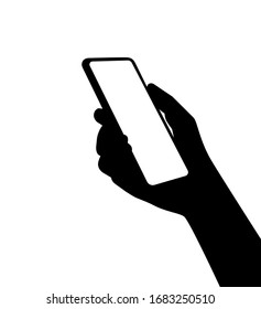 A silhouette of a smartphone in person hand. Using new computer technologies and applications for mobil phones.