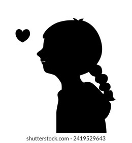 Silhouette of a smiling child girl with a heart in self-love concept.