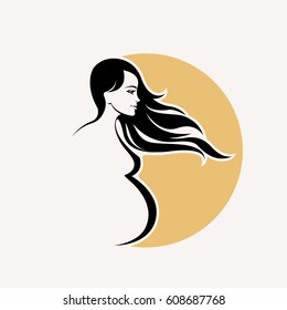 Silhouette of a smiling, pregnant lady with long, flowing hair.Vector icon.