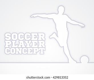 A silhouette of a soccer football player about to kicking the ball