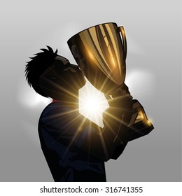 Silhouette soccer player kissing gold trophy with gray background