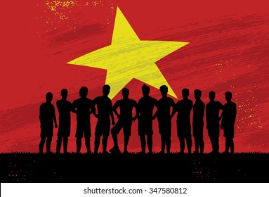 Silhouette of soccer players standing together in front of Vietnamese flag