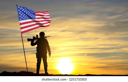 Silhouette of a soldier with American flag at sunset. National Holidays background. EPS10 vector