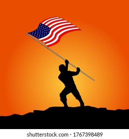 silhouette of a soldier holding the American flag