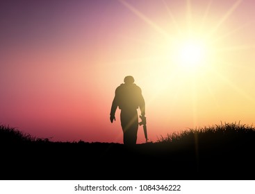 Silhouette of a soldier walking against a sunset sky