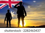 Silhouette of Soldiers with Australian flag on background of sunset. Concept - Armed Force. EPS10 vector