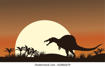 Silhouette of spinosaurus and big sun at the morning