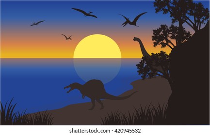 Silhouette of spinosaurus and pterodactyl at the morning