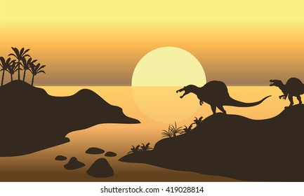 Silhouette of spinosaurus in riverbank at the afternoon