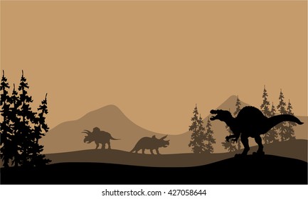Silhouette of Spinosaurus and Triceratops in the hills