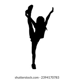 Silhouette of a sporty female doing aerobics or gymnastic action pose. Silhouette of a woman in gym doing acrobatic pose.