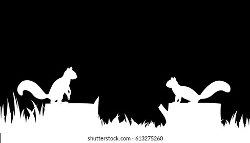 Silhouette of a squirrel on a tree stump.