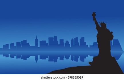 Silhouette of statue liberty from sea at night