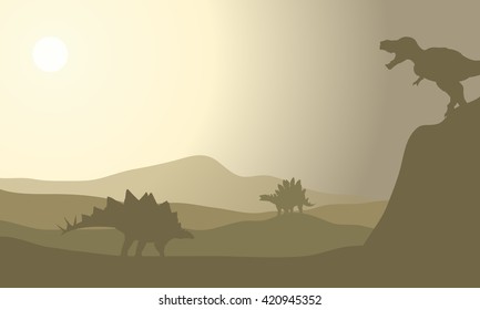 Silhouette of stegosaurus in desert with gray 