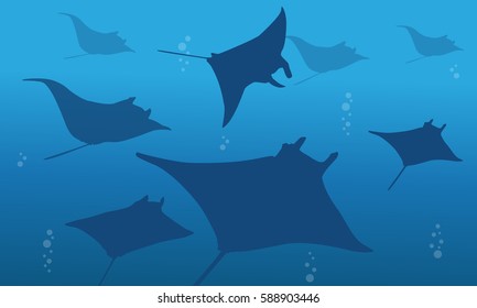 Silhouette of stingray on ocean landscape