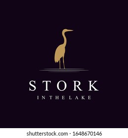 Silhouette stork logo design is standing on the lake