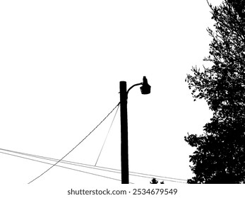 A silhouette of a street lamp