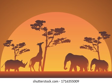 Silhouette of a sunset in the savannah with elephants, giraffes and rhinos.