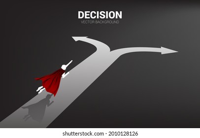 Silhouette of superhero fly over to crossroad. Concept of time to make decision in business direction.