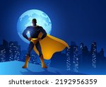 Silhouette of a superhero standing on the edge of a building with night cityscape and full moon as the background