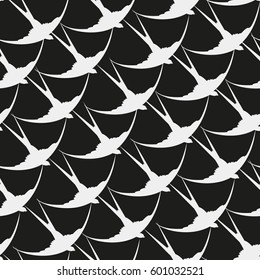 Silhouette of swallow. Seamless background with birds