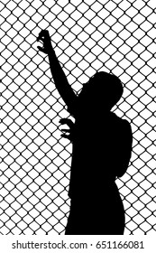 Silhouette of a teenager trying to escape from wired enclosure