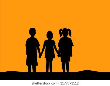 Silhouette of three children friendship at sunset.People friendship silhouette