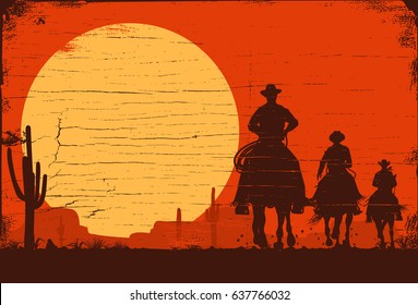 Silhouette of three cowboys riding horses on a wooden board