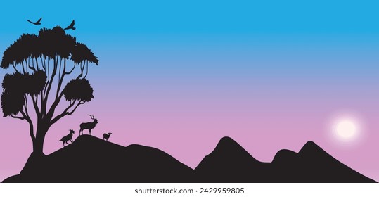 Die Silhouette von drei Ziegen, die unter einem schattigen Baum auf einem Hügel gehen und mehrere Vögel, die in den schönen Himmel fliegen