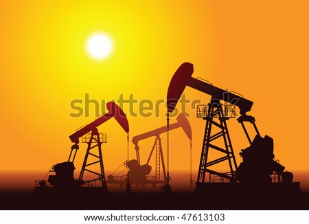 Silhouette of three oil rigs