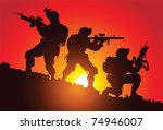 Silhouette of three soldiers on the battlefield