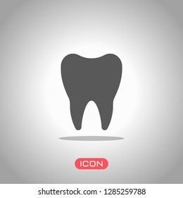 Silhouette of tooth. Simple icon. Icon under spotlight. Gray background