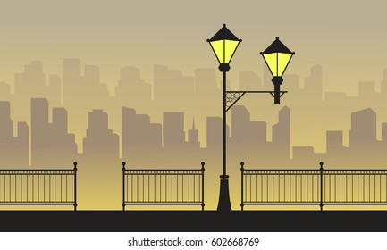 Silhouette town background with street lamp scenery