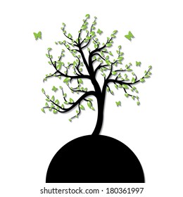 Silhouette of a tree with green leaf and butterfly
