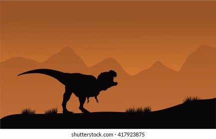 Silhouette of T-Rex in the fields with brown backgrounds